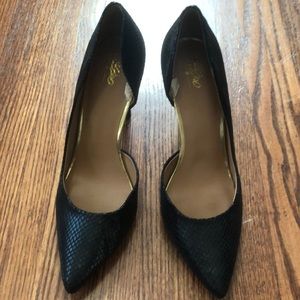 Black pointed toe pumps